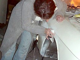 Christel preparing the wing for painting